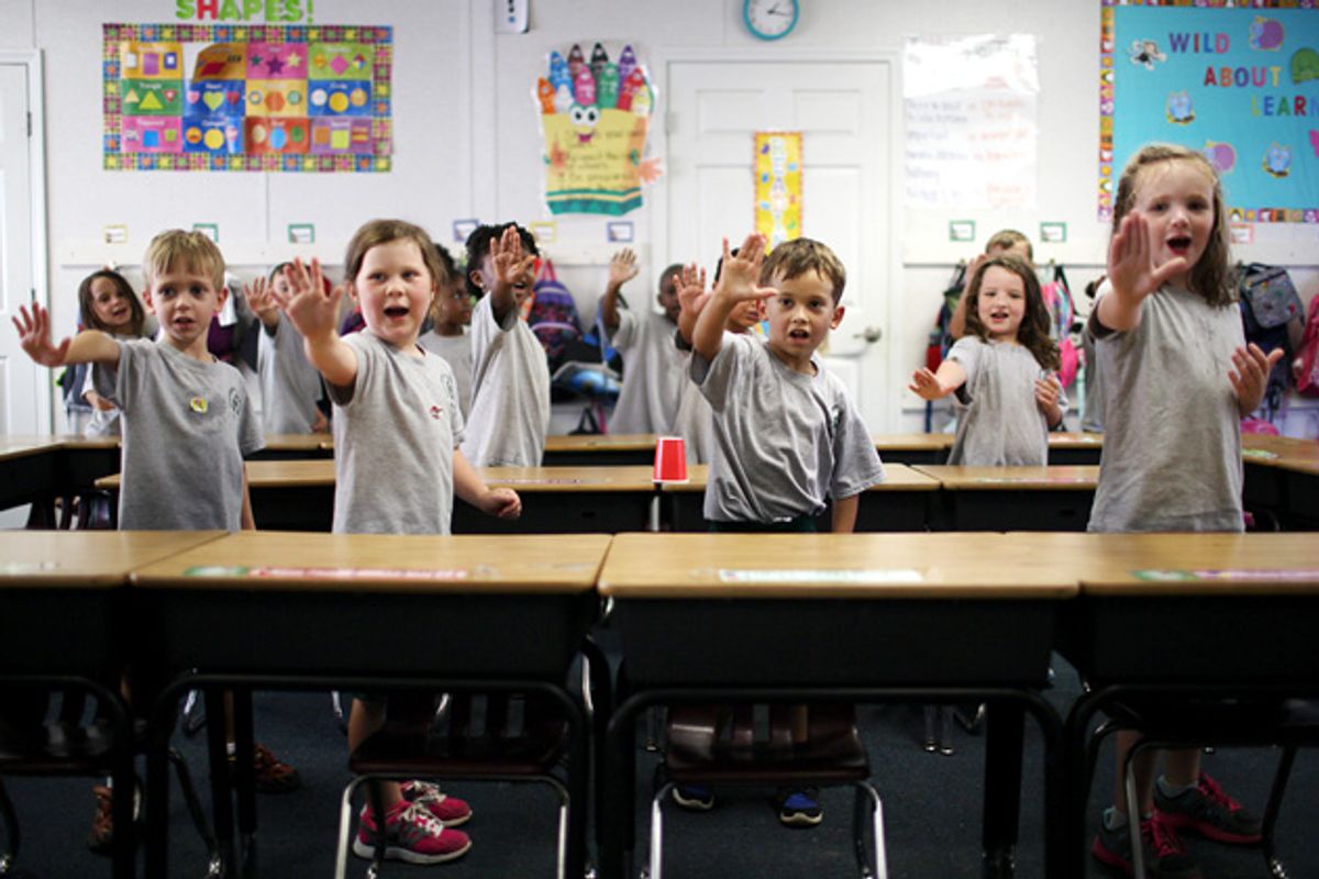 Columbus Charter School in Whiteville, N.C., uses a rigid instructional approach in which teachers stick to a script and drill students, like the kindergarteners above, through call and response.  (Travis Dove for ProPublica)