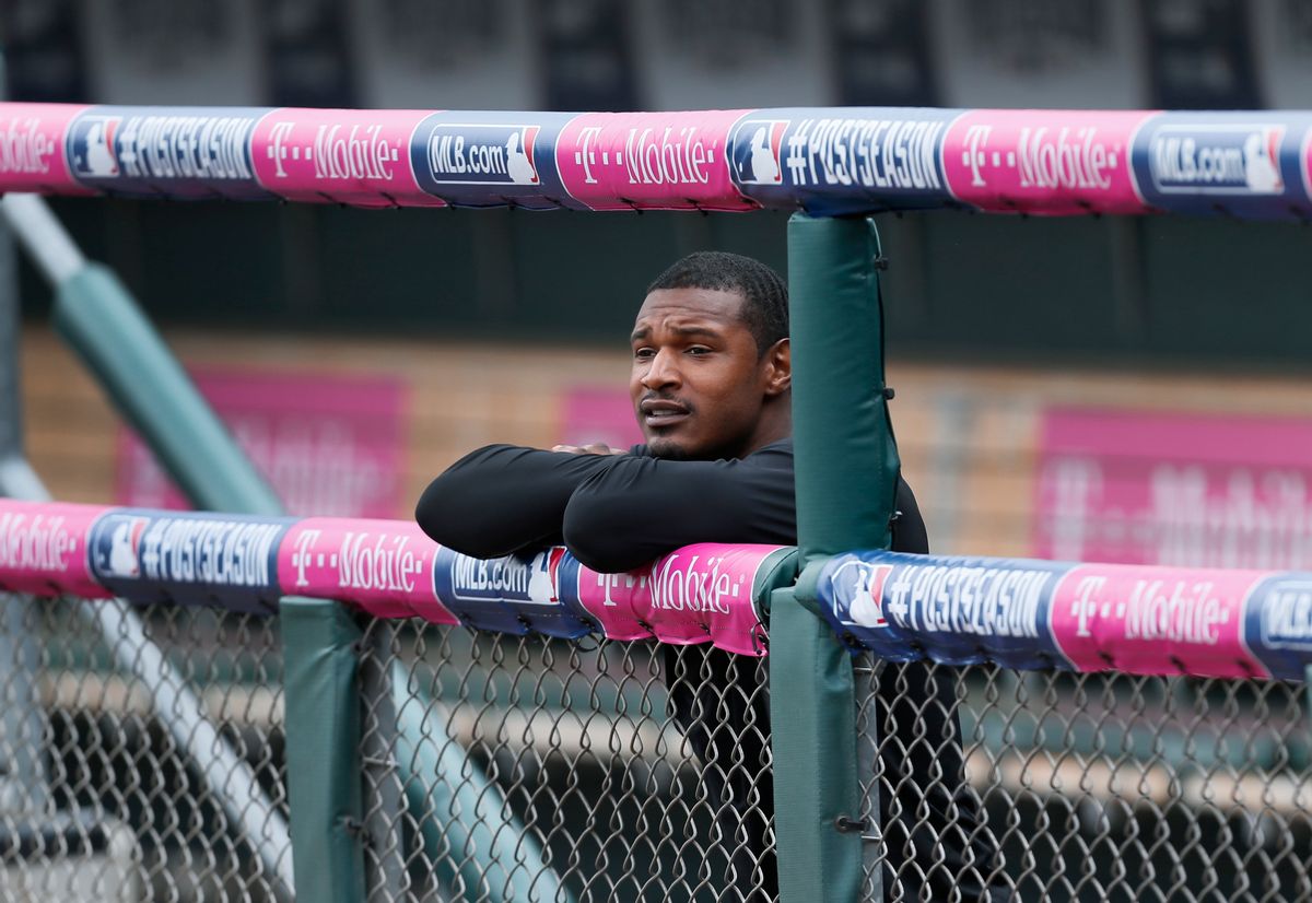 Baltimore Orioles' Adam Jones watches from the dugout railing during baseball practice, Saturday, Oct. 4, 2014, in Detroit, in preparation for Sunday's Game 3 of the American League Division Series against the Detroit Tigers. Baltimore leads the best-of-five games series 2-0. (AP Photo/Paul Sancya) (AP)
