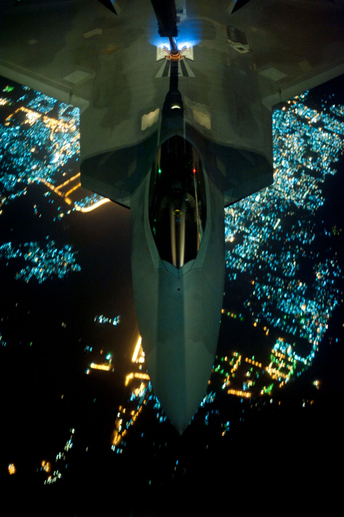 AP10ThingsToSee - In this Friday, Sept. 26, 2014 photo, released by the U.S. Air Force, a U.S Air Force KC-10 Extender refuels an F-22 Raptor fighter aircraft prior to strike operations in Syria. The F-22s, making their combat debut, were part of a strike package that was engaging Islamic State group targets in Syria. Washington and its Arab allies opened the air assault against the extremist group on Sept. 23, striking military facilities, training camps, heavy weapons and oil installations. The campaign expands upon the airstrikes the United States has been conducting against the militants in Iraq since early August. (AP Photo/U.S. Air Force, Russ Scalf ) (AP)