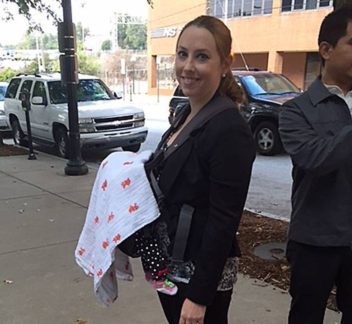 In this Oct 7, 2014 photo released by Stacy Ehrisman-Mickle, Ehrisman-Mickle poses for a photo with her daughter, in Atlanta. Ehrisman-Mickle, an immigration lawyer, brought her 4-week-old baby to court after Immigration Judge J. Dan Pelletier Sr. denied her request to delay a hearing that fell during her maternity leave. During the hearing, her baby began to cry, and Pelletier scolded her for inappropriate behavior. (AP)