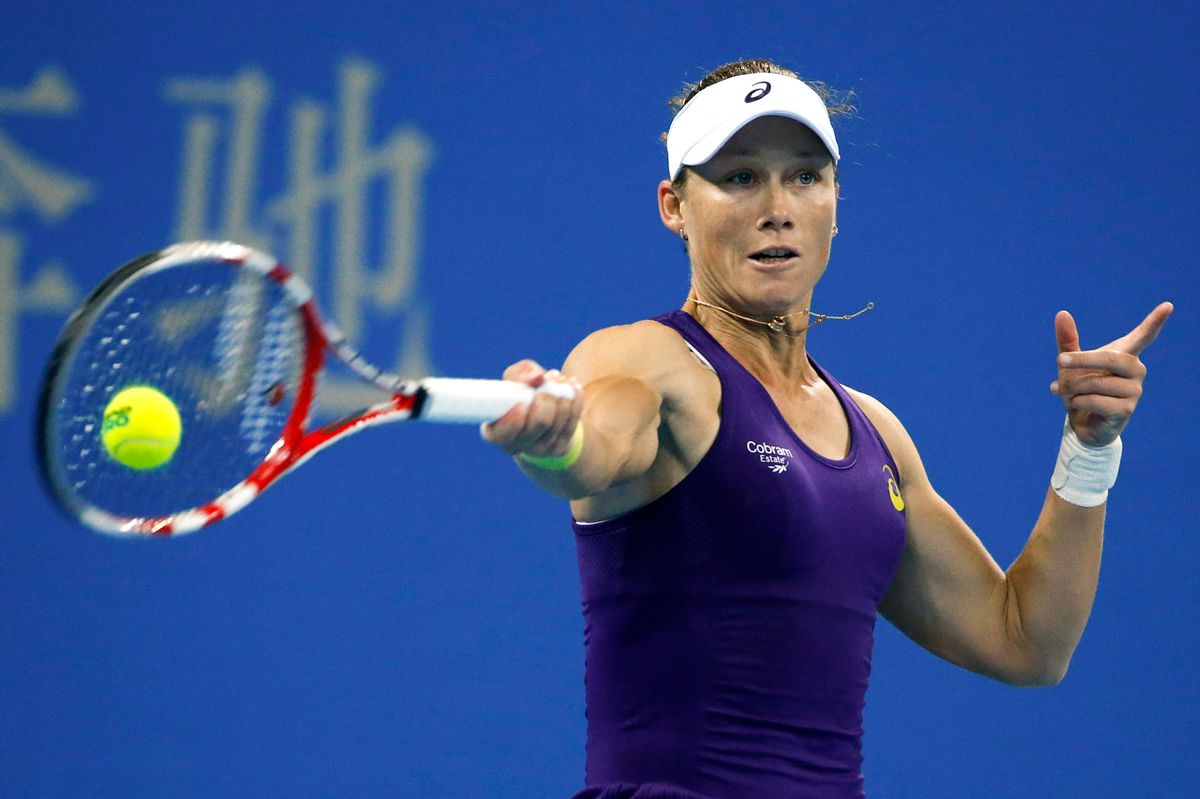 Samantha Stosur from Australia return a shots from  Caroline Wozniacki of Denmark during the China Open tennis tournament at the National Tennis Stadium in Beijing, China, Wednesday, Oct. 1, 2014. (AP Photo/Vincent Thian) (Vincent Thian)