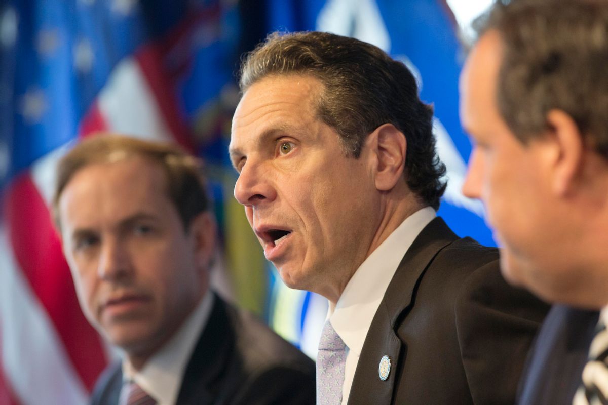 New York Governor Andrew Cuomo, center, speaks at a news conference, Friday, Oct. 24, 2014 in New York. At left is Dr. Howard Zucker, acting commissioner of the New York State Department of Health, and New Jersey Governor Chris Christie is at right. The governors announced a mandatory quarantine for people returning to the United States through airports in New York and New Jersey who are deemed "high risk." In the first application of the new set of standards, the states are quarantining a female healthcare worker returning from Africa who took care of Ebola patients. (AP Photo/Mark Lennihan)     (AP)