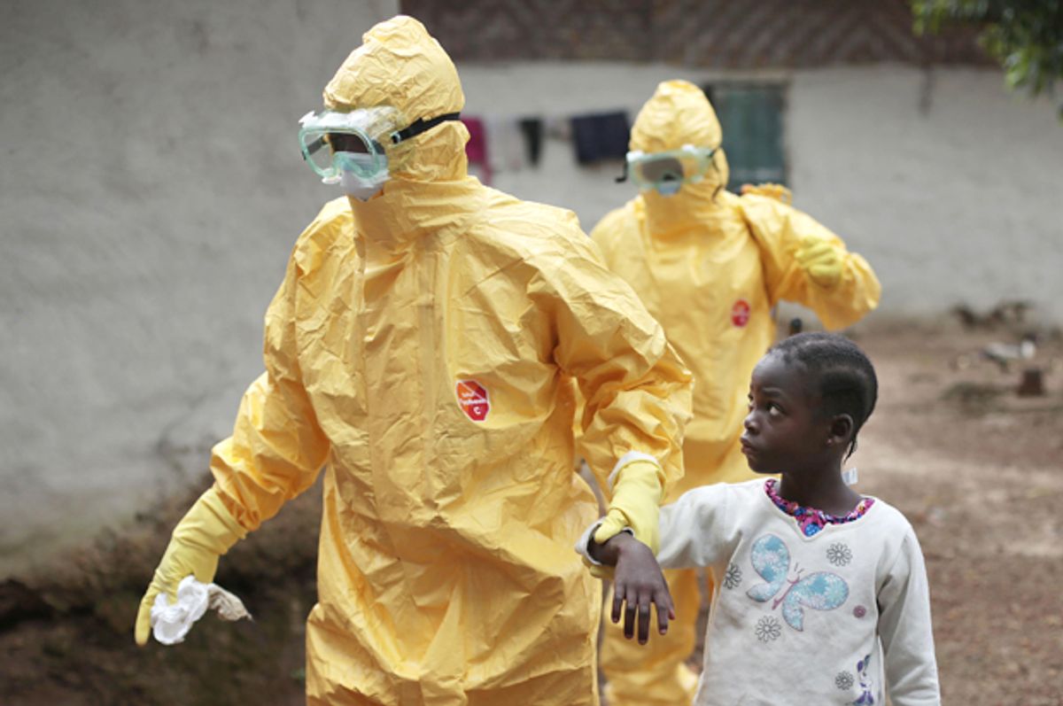 Nowa Paye, 9, is taken to an ambulance after showing signs of the Ebola infection in the village of Freeman Reserve, Liberia, Sept. 30, 2014.                  (AP/Jerome Delay)