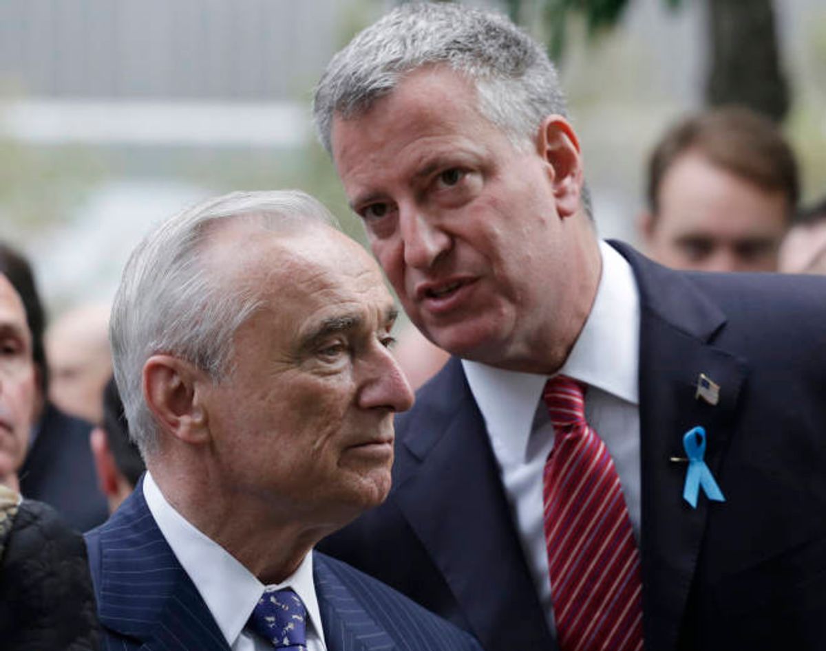 FILE - In this Sept. 11, 2014 file photo, New York City Police Commissioner Bill Bratton, left, and Mayor Bill de Blasio talk during memorial observances at the site of the World Trade Center in New York. De Blasios relationship with police, already strained by accusations he sided with frequent NYPD critic Al Sharpton over the chokehold death of an unarmed suspect, suffered another hit with revelations a top aide is living with a convicted killer who has often mocked officers as pigs.(AP Photo/Mark Lennihan, Pool, File) (AP)