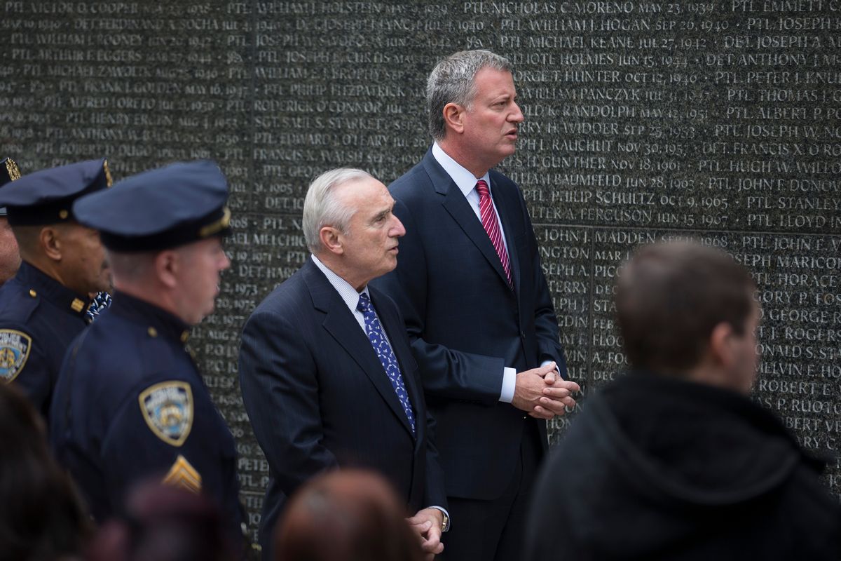 Mayor Bill de Blasio talks with New York City Police Commissioner Bill Bratton during a NYPD Memorial ceremony last October in New York.  (AP Photo/John Minchillo)