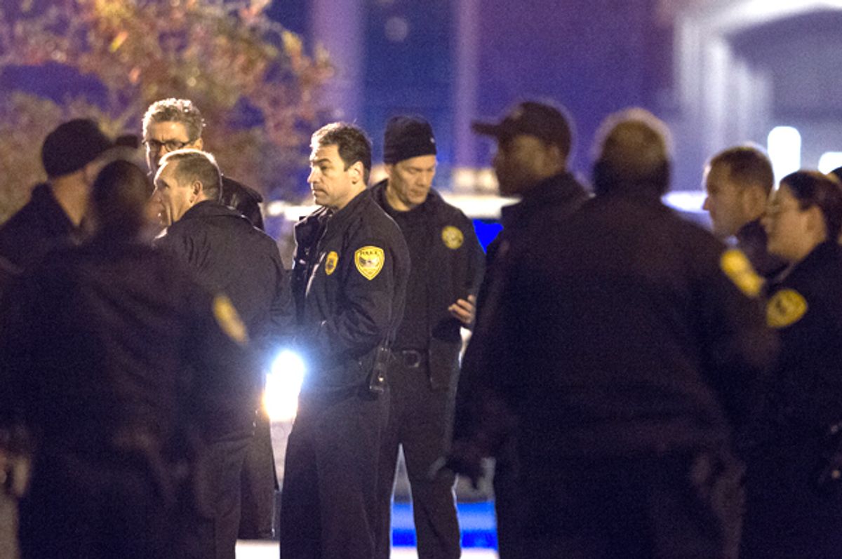 Tallahassee police chief Michael Deleo, center, talks with his officers as they investigate a shooting on the Florida State University campus in Tallahassee, Fla. Nov 20, 2014.        (AP/Mark Wallheiser)