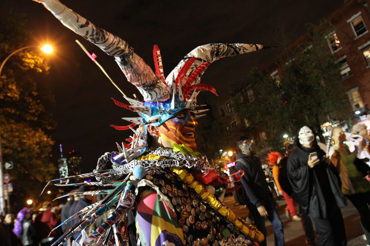 Dressed as Mr. Halloween, Rolanda Vega takes part in the Village Halloween Parade in New York Friday Oct. 31, 2014. (AP Photo/Tina Fineberg) (AP)