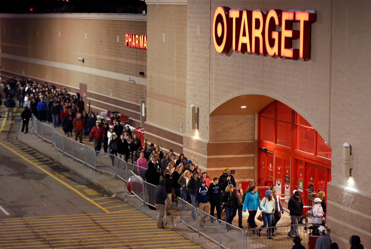 Shoppers head into Target just after thei doors opened at midnight on Black Friday, Nov. 28, 2014, in South Portland, Maine. (AP Photo/Robert F. Bukaty) (AP)