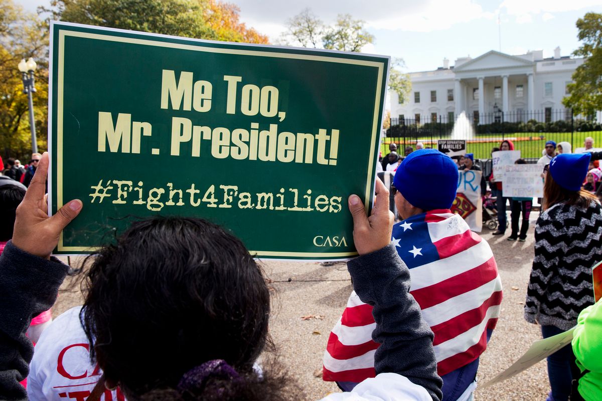 People rally for comprehensive immigration reform, Friday, Nov. 7, 2014, outside of the White House. After the midterm elections immigration groups are pushing for executive action. A theme of the rally was ceasing deportation of parents who are in the United States illegally. (AP Photo/Jacquelyn Martin)  (AP)