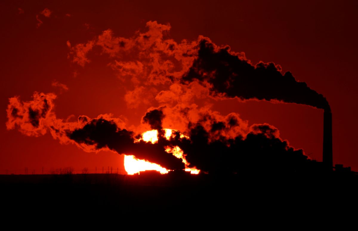 FILE- In this March 8, 2014 file photo, steam from the Jeffrey Energy Center coal-fired power plant is silhouetted against the setting sun near St. Mary's, Kan. A groundbreaking agreement struck Wednesday, Nov. 12, 2014, by the United States and China puts the world's two worst polluters on a faster track to curbing the heat-trapping gases blamed for global warming. Energized by these new targets set by China and the United States, the worlds top climate polluters, U.N. global warming talks resume Dec. 1, 2014 in Peru, with unusual optimism despite evidence that human-generated climate change is already happening and bound to get worse. (AP Photo/Charlie Riedel, File)  (AP)