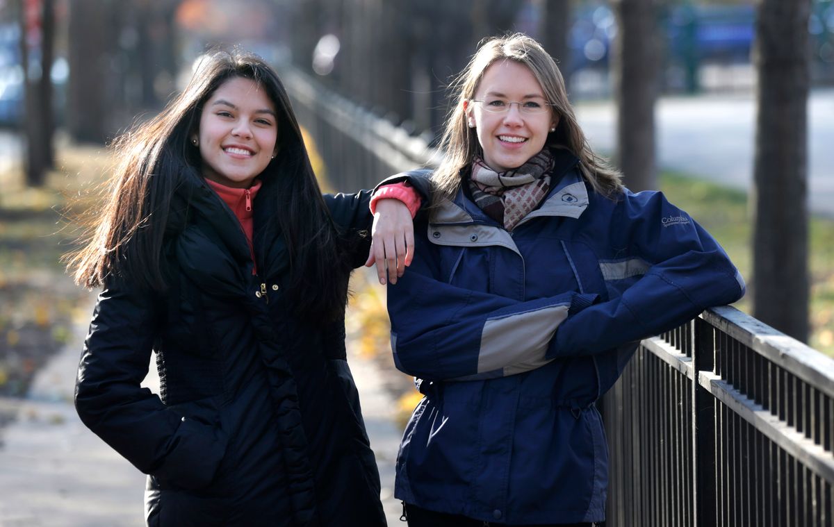 In this Nov. 19, 2014 photo, Lakeview High School teacher Kristin Hu, right, who attends the LaSalle Street Church, poses for a portrait with student Lucy, outside the school in Chicago. In September, members and regulars at the church each received $500 checks from the church. Hu plans to give $500 to a Dreamer organization or start a scholarship foundation for the kids. Lucy, a Mexican-born Dreamer in her class, inspired Hu after she spoke of how she and others want to attend college but dont qualify for financial aid because of their immigration status. (AP Photo/Charles Rex Arbogast) (AP)