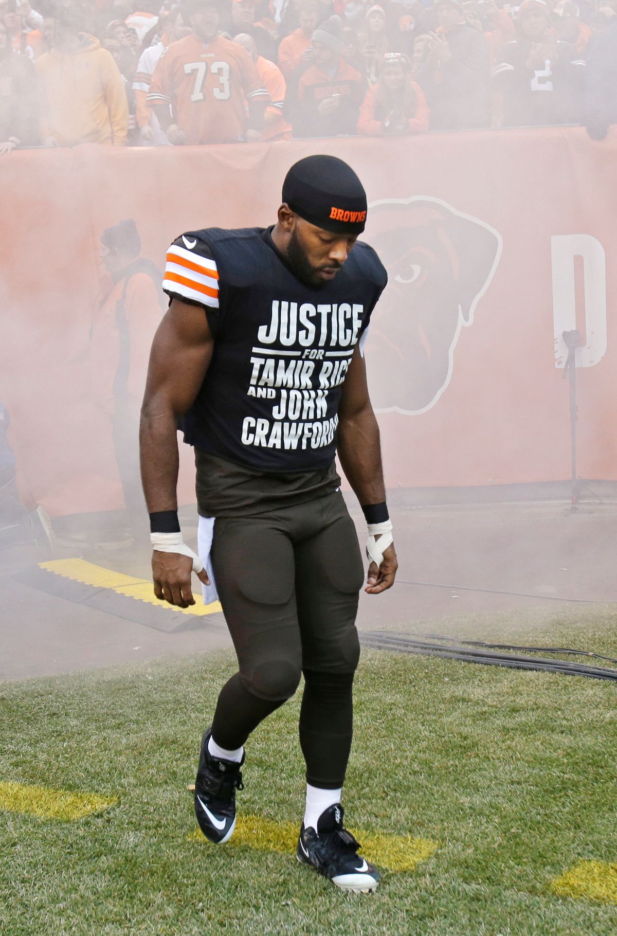 In this Dec. 14, 2014, photo Cleveland Browns wide receiver Andrew Hawkins wears a shirt calling attention to two black Ohioans killed during encounters with law enforcement before an NFL football game against the Cincinnati Bengals in Cleveland. The Browns say they respect the police and their player's rights to protest. (AP/Tony Dejak)