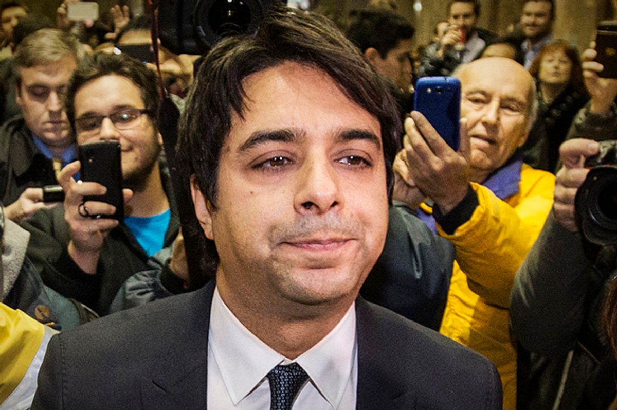 Jian Ghomeshi leaves court with his legal team after getting bail on multiple counts of sexual assault, Toronto, November 26, 2014.       (Reuters/Mark Blinch)