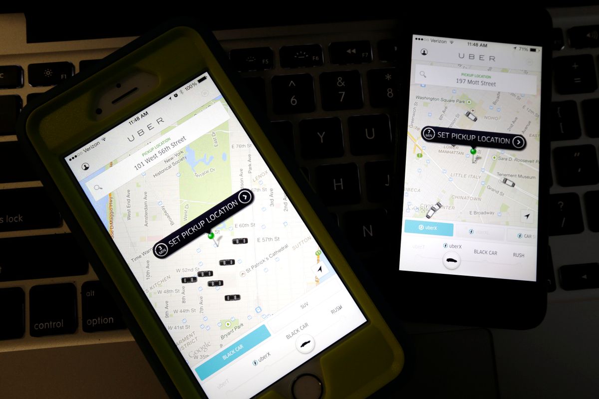 FILE - This Friday, Nov. 21, 2014 file photo taken in Newark, N.J., shows smartphones displaying Uber car availability in New York. With assault cases against their drivers in India and Chicago this week, popular ride-hailing app Uber is in for yet another public relations ordeal that follows ongoing criticisms about its corporate ethics and culture. And yet, neither government nor the taxi industry has regulators been able to curb the companys meteoric growth, one that has spurred an entire industry. (AP Photo/Julio Cortez, File) (AP)