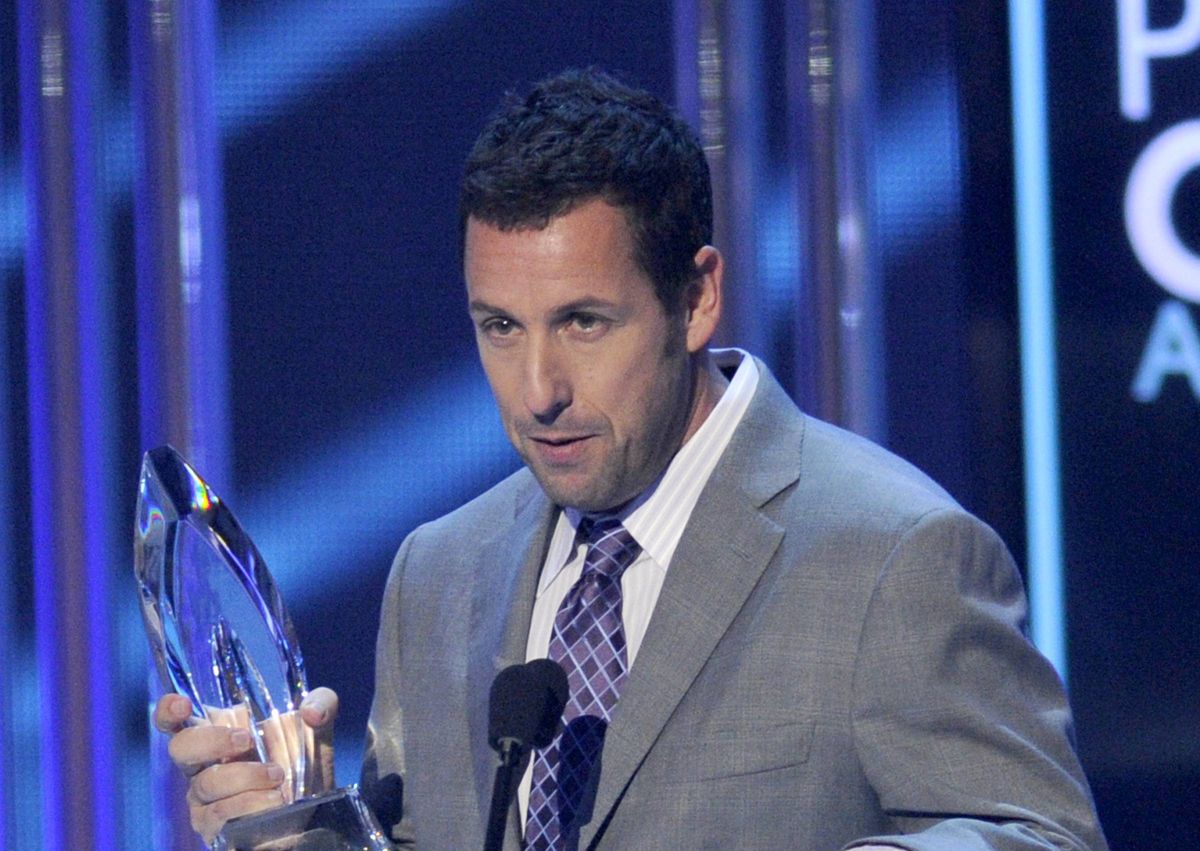 Adam Sandler accepts the award for favorite comedic movie actor at the People's Choice Awards at the Nokia Theatre on Wednesday, Jan. 7, 2015, in Los Angeles.   (Chris Pizzello/invision/ap)