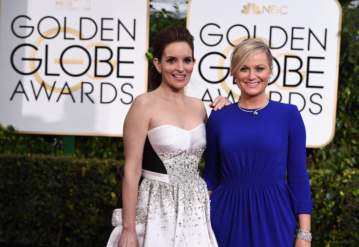 Tina Fey, left, and Amy Poehler arrive at the 72nd annual Golden Globe Awards.      (Jordan Strauss/invision/ap)