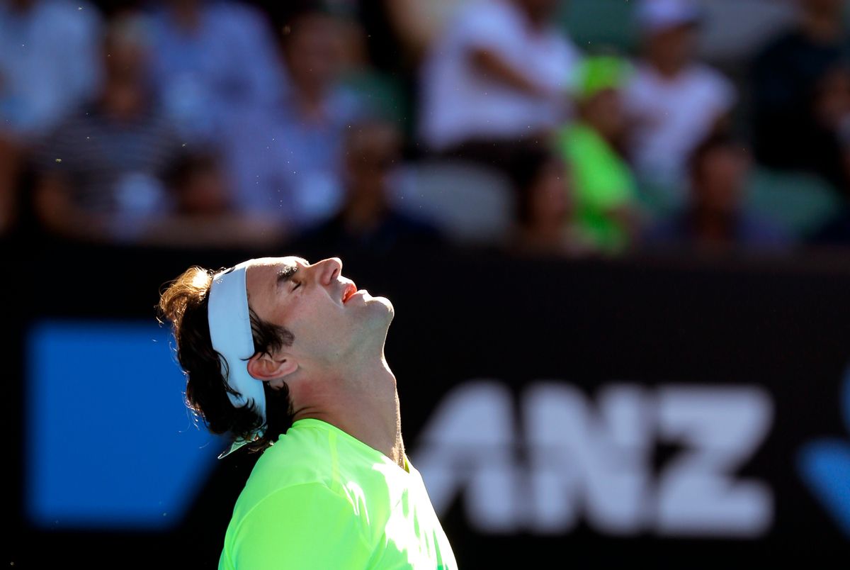 Roger Federer of Switzerland reacts as he plays Andreas Seppi of Italy during their third round match at the Australian Open tennis championship in Melbourne, Australia, Friday, Jan. 23, 2015. (AP Photo/Bernat Armangue) (Bernat Armangue)