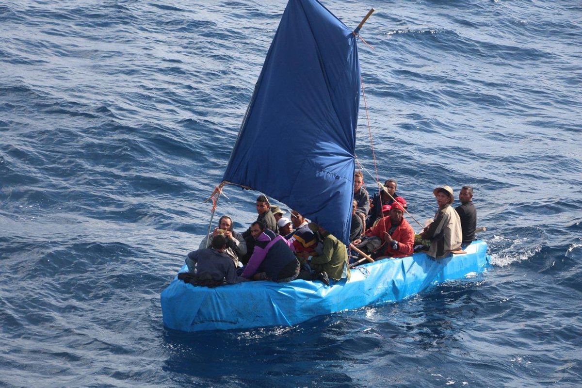 This Jan. 1, 2015 photo provided by the U.S. Coast Guard shows 24 Cuban migrants in the waters south of Key West, Fla. The Cubans were later repatriated. Coast Guard officials said Monday, Jan. 5, 2015, that the number of Cubans attempting to reach Florida illegally by sea has surged since the U.S. and Cuba announced they would restore diplomatic relations. (AP Photo/U.S. Coast Guard) (AP)