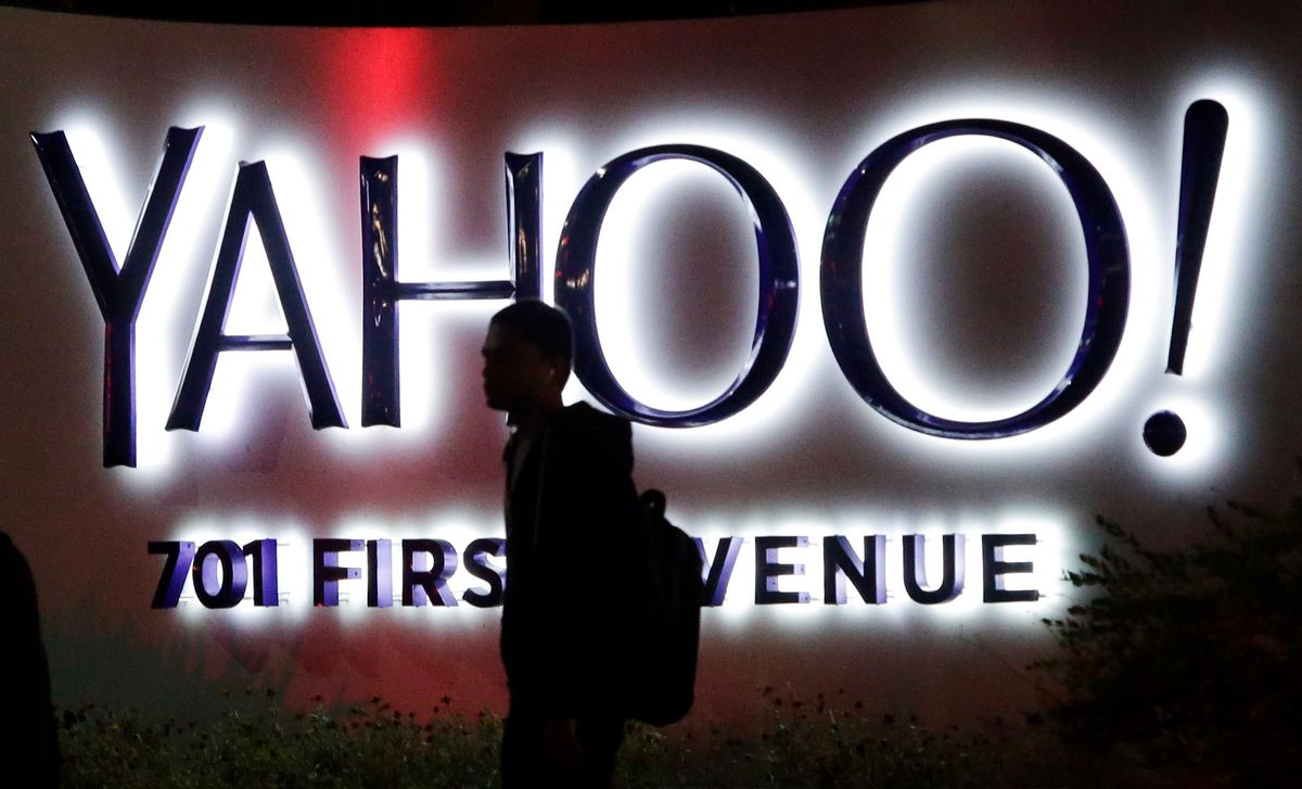 In this Nov. 5, 2014 photo, a person walks in front of a Yahoo sign at the company's headquarters in Sunnyvale, Calif. Yahoo reports quarterly financial results on Tuesday, Jan. 27, 2015. (AP Photo/Marcio Jose Sanchez) (AP)