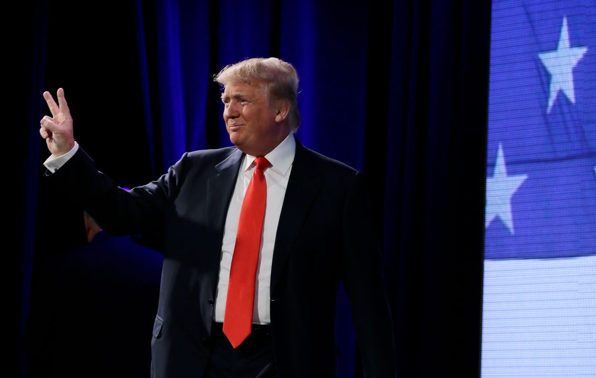 Donald Trump gestures to the audience before speaking at the Freedom Summit, Saturday, Jan. 24, 2015, in Des Moines, Iowa. (AP Photo/Charlie Neibergall)   (AP)