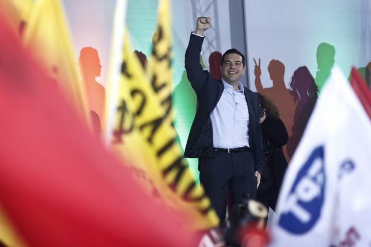 Alexis Tsipras, leader of Greece's Syriza left-wing main opposition party waves to his supporters as he arrives for a pre-election speech at Omonia Square in Athens  (AP Photo/Petros Giannakouris)