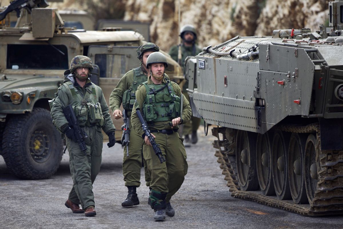 Israeli soldiers secure the Israel-Lebanon border, Wednesday, Jan. 28, 2015. The Lebanese Hezbollah group is claiming responsibility for todays attack on an Israeli military convoy. Hezbollah claims the attack destroyed a number of Israeli vehicles and caused casualties among "enemy ranks." Israel later fired at least 35 artillery shells into Lebanon. (AP Photo/Ariel Schalit) (AP)