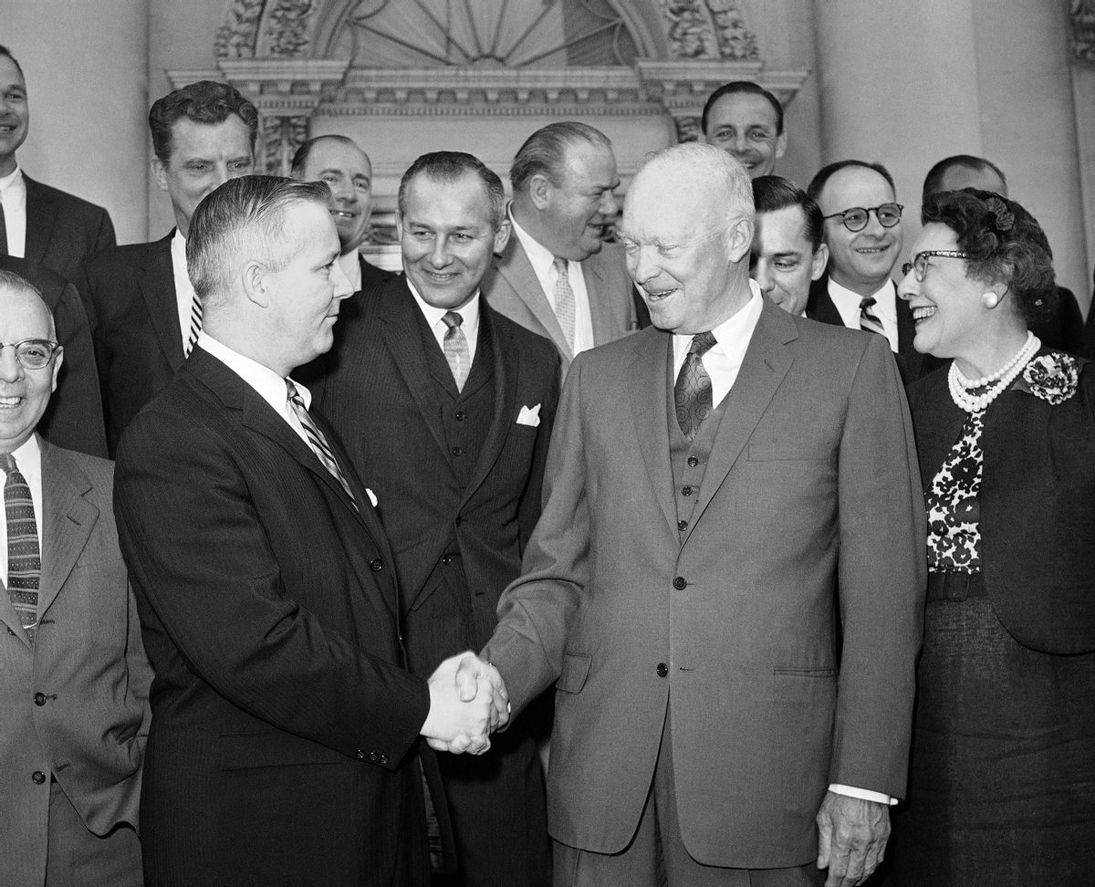 FILE - In this May 12, 1960, file photo, President Dwight Eisenhower, front right, shakes hands with Rep. Arch Moore, of West Virginia, as he poses with a group of Republican congressmen after breakfast at the White House, in Washington. Moore, whose guilty pleas to federal corruption charges overshadowed his record as his era's most successful Republican in Democrat-dominated West Virginia, died Wednesday, Jan. 7, 2015. He was 91. (AP Photo/Bill Allen, File) (AP)