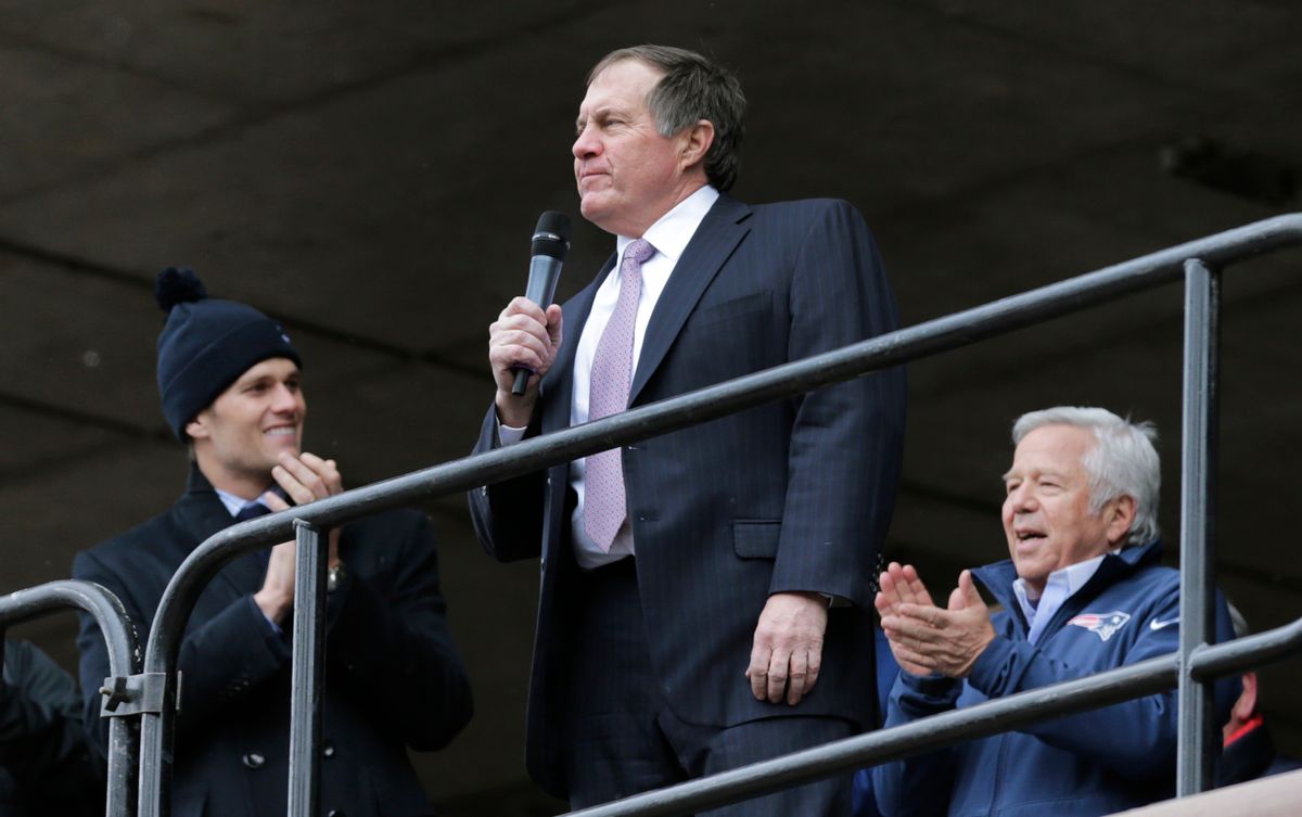 New England Patriots head coach Bill Belichick, center, addresses a crowd of supporters during an NFL football send-off rally at City Hall in Boston Monday, Jan. 26, 2015. The Patriots play the Seattle Seahawks in Sunday's Super Bowl XLIX in Glendale, Ariz.  At left is Patriots quarterback Tom Brady, at right is Patriots owner Robert Kraft. (AP Photo/Charles Krupa) (AP)