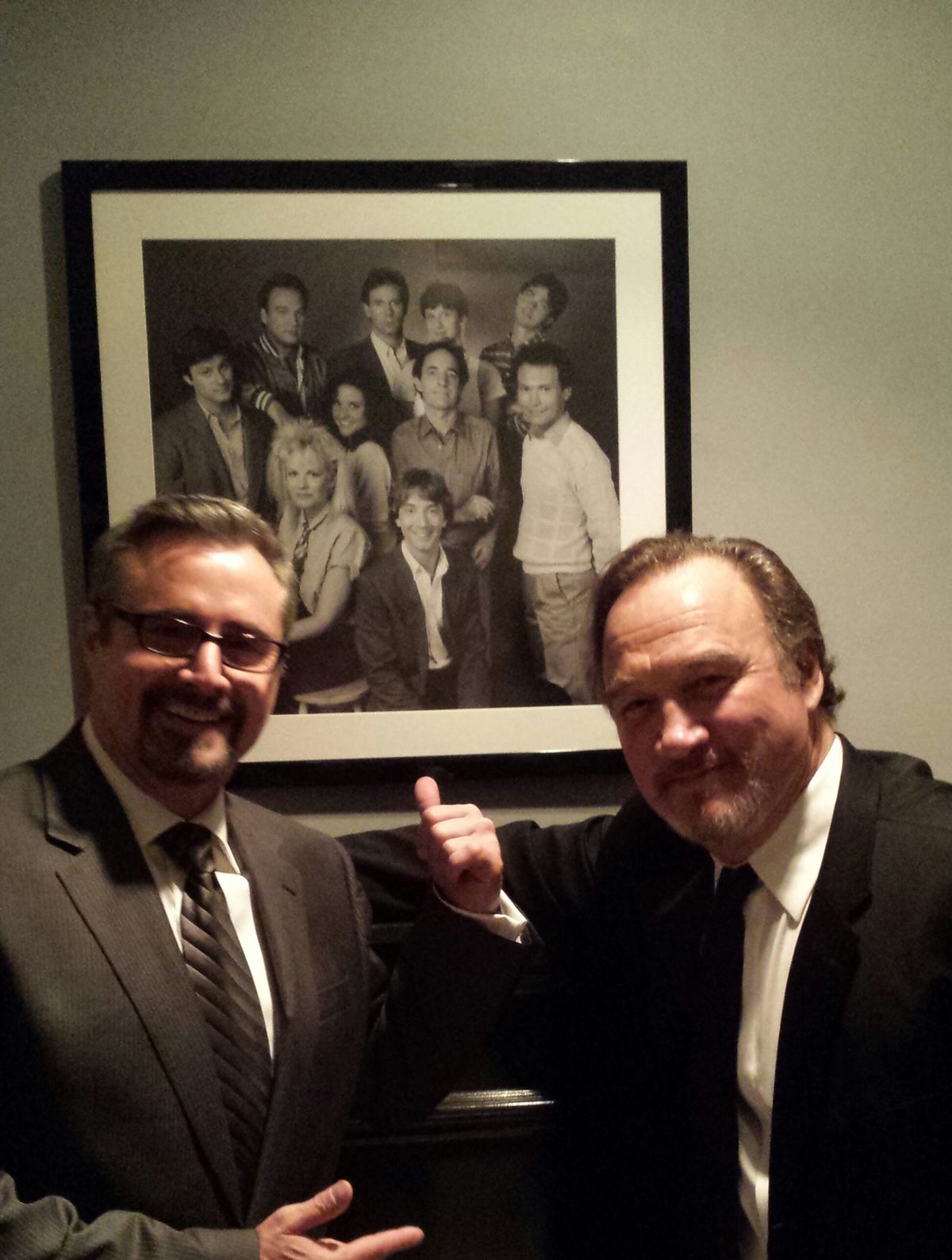  Gary Kroeger and Jim Belushi at 30 Rock, with their cast photo from the 1984-85 season of "SNL"       (GaryHasIssues.com)