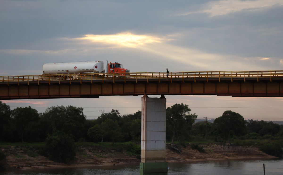 In this Feb. 13, 2015 photo, a truck loaded with crude from the Campo Rubiales oil field crosses the bridge over the Manacacias River in Puerto Gaitan, Colombia. A net oil importer not too long ago, Colombia is now the fifth biggest supplier to the U.S. (AP Photo/Fernando Vergara) (AP)