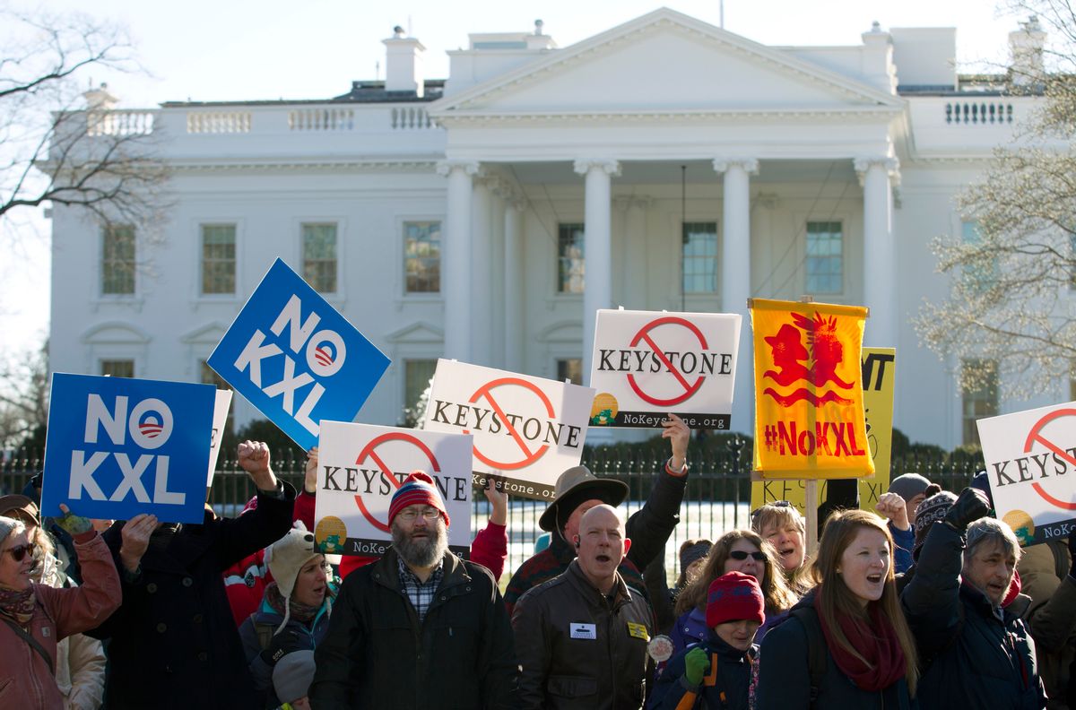 FILE - In this Jan. 10, 2015, file photo, demonstrators rally in support of President Barack Obama's pledge to veto any legislation approving the Keystone XL pipeline, outside the White House in Washington. (AP Photo/Jose Luis Magana, File)   (AP)