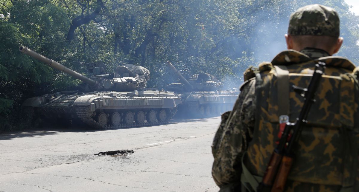 FILE- In this file photo taken on Friday, June  20, 2014, Pro-Russian troops prepare to travel in a tank on a road near the town of Yanakiyevo, Donetsk region, eastern Ukraine.  Russia has denied it is sending arms and troops to support the separatists in Ukraine,  but dozens of soldiers have been reported killed during drills in the Rostov region of southern Russia, but rights groups have actually attributed the deaths to the conflict over the border in Ukraine. (AP Photo/Dmitry Lovetsky, file) (AP)