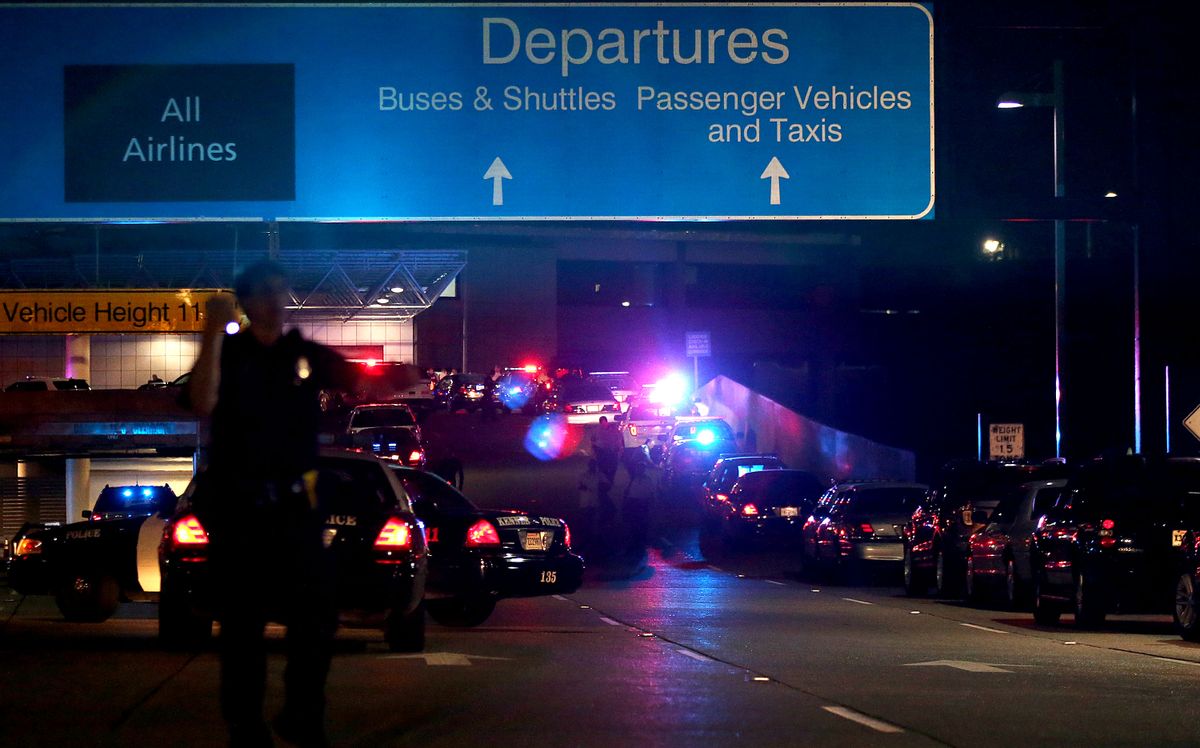 The ramp to departures is seen blocked off by emergency vehicles  at the New Orleans International Airport, Friday, March 20, 2015, in Kenner, La. Richard White sprayed a TSA agent in the face with wasp killer then slashed a second guard with a machete before a third agent shot him three times at a security checkpoint in the New Orleans international airport Friday. (AP Photos/Jonathan Bachman) (AP)