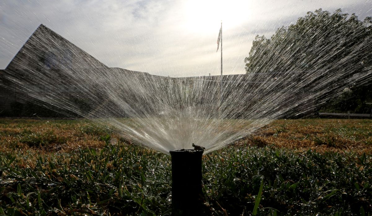 FILE - In this July 15, 2014, file photo sprinklers water a lawn in Sacramento, Calif. (AP Photo/Rich Pedroncelli, File)    (AP)