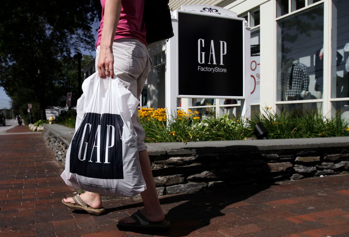 FILE - In this Wednesday, Aug. 17, 2011, file photo, a shopper leaves the Gap store in Freeport, Maine.  (AP Photo/Pat Wellenbach, File) (AP)