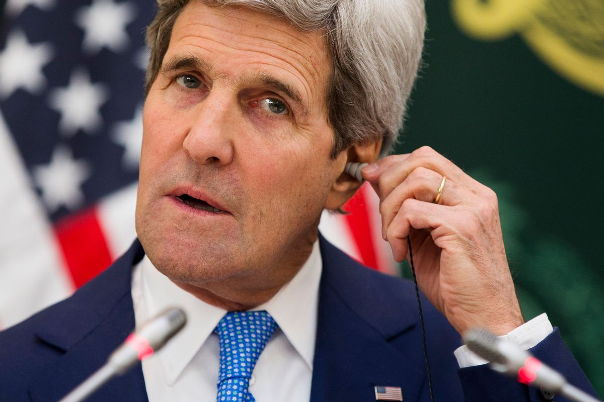 U.S. Secretary of State John Kerry puts in an ear piece for translation during a news conference with Saudi Foreign Minister Saud bin Faisal bin Abdulaziz Al Saud on Thursday, March 5, 2015, in Riyadh, Saudi Arabia. Kerry sought Thursday to ease Gulf Arab concerns about an emerging nuclear deal with Iran and explore ways to calm instability in Yemen and other troubled nations in the Middle East. (AP Photo/Evan Vucci, Pool) (AP)