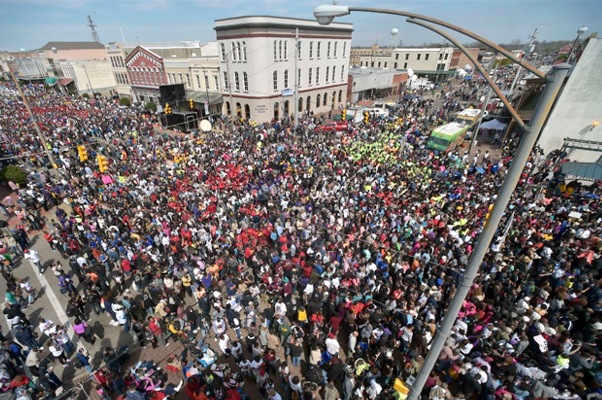 Crowds gather before a symbolic walk across the Edmund Pettus Bridge, Sunday, March 8, 2015, in Selma, Ala.     (AP/Mike Stewart)