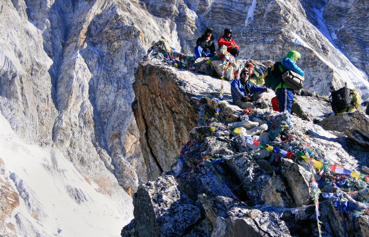 Unknown people squatting on the top of the Kala Patthar Mountain near Mount Everest Base Camp in the Himalayas, Nepal.    (PlusONE/Shutterstock)