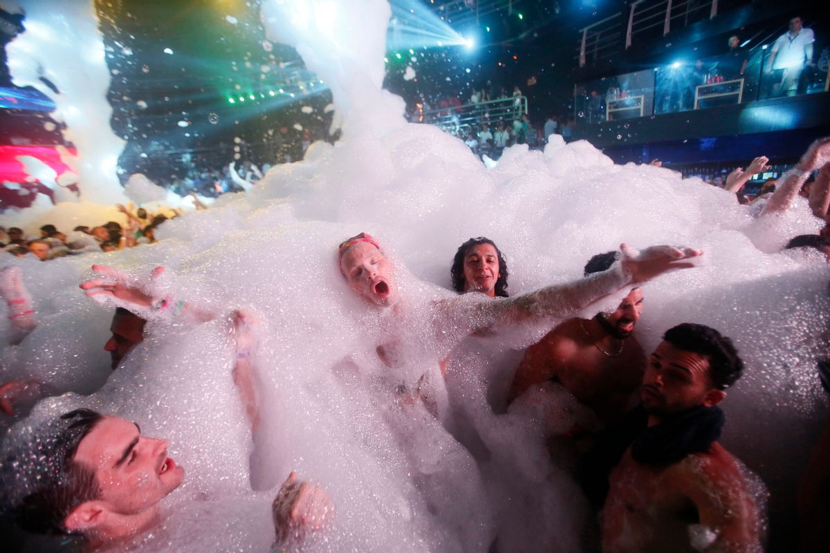 In this early Monday, March 16, 2015 photo,  partygoers dance in foam at The City nightclub in the Caribbean resort city of Cancun, Mexico. Cancun is one of the top foreign destinations for U.S. college students during spring break. (AP Photo/Israel Leal) (AP)