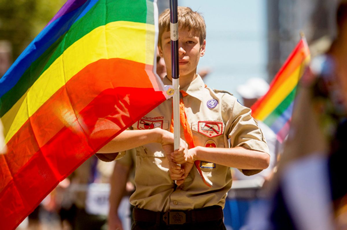 Boy Scout Casey Chambers carries a rainbow flag during the San Francisco Gay Pride Festival in California June 29, 2014.       (Reuters/Noah Berger)