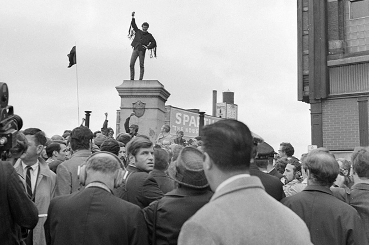 A demonstrator istands atop a pedestal from which the statue of the Haymarket Riot policeman was blasted days earlier, Chicago, Oct. 11, 1969.   (AP)