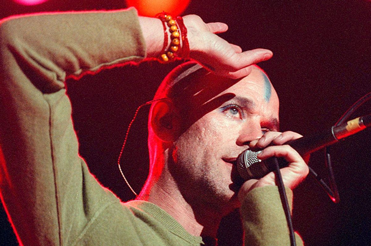 Michael Stipe, lead singer for R.E.M., sings to an audience at the Shoreline Ampitheatre during Neil Young's Bridge School benefit concert Saturday, Oct. 18, 1998, in Mountain View, Calif. (AP Photo/John Todd)      (John Todd)