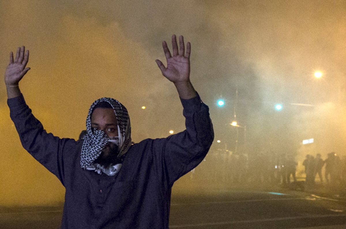 A man attempting to keep peace between protesters and riot police in Baltimore, April 28, 2015.        (Reuters/Adrees Latif)