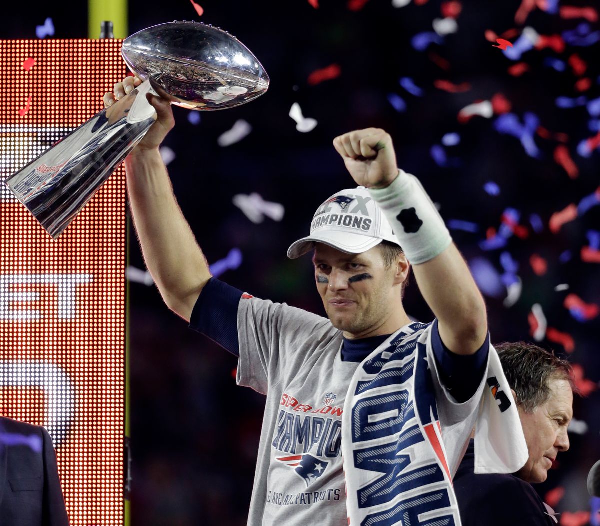 FILE - In a Feb. 1, 2015, file photo New England Patriots quarterback Tom Brady holds up the Vince Lombardi Trophy after the Patriots defeated the Seattle Seahawks 28-24 in NFL Super Bowl XLIX in Glendale, Ariz.   The NFL Monday, May 11, 2015, suspended Super Bowl MVP   Brady for the first four games of the season. (AP Photo/Mark Humphrey) (AP)