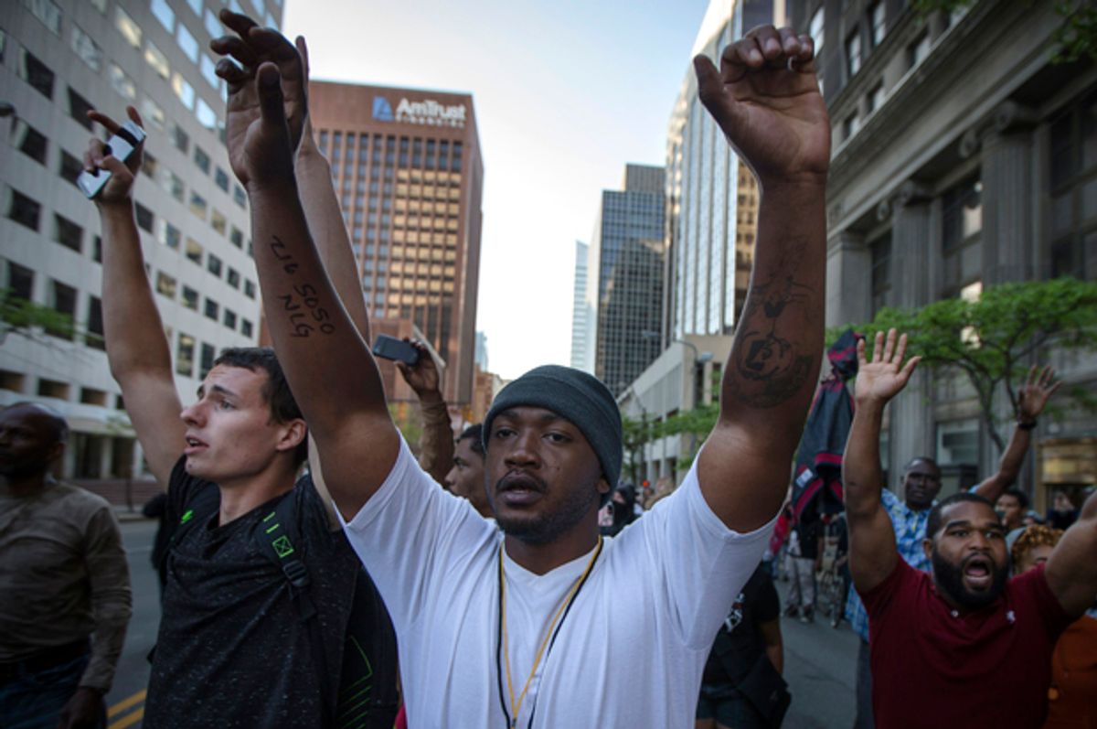 Demonstrators march against the acquittal of Michael Brelo, May 23, 2015, in Cleveland.        (AP/John Minchillo)