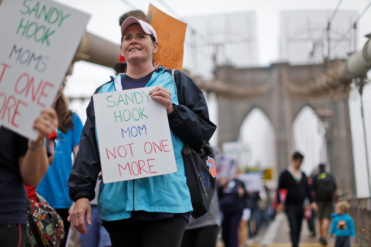 Beth Hegarty, a Sandy Hook Elementary School mother who happened to be inside the school the day of the shooting with her three daughters, all of whom survived, marches over the Brooklyn bridge during the third annual Brooklyn bridge march and rally to end gun violence Saturday, May 9, 2015, in New York. Organizers said the proliferation of guns results in an average of more than 80 deaths a day across the country. (AP Photo/Mary Altaffer) (AP)