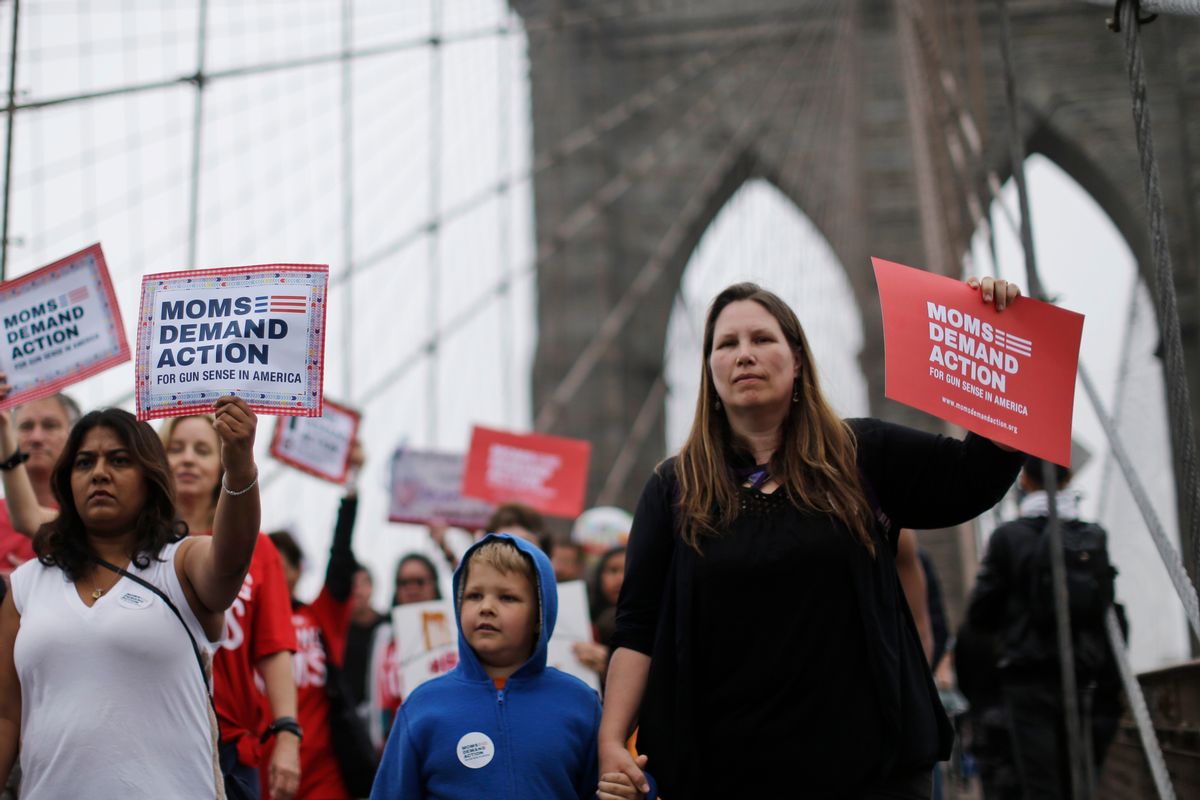 Demonstrators march over the Brooklyn bridge during the third annual Brooklyn bridge march and rally to end gun violence Saturday, May 9, 2015, in New York. Organizers said the proliferation of guns results in an average of more than 80 deaths a day across the country. (AP Photo/Mary Altaffer) (AP)