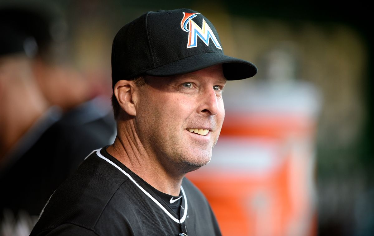 FILE- In this May 4, 2015, file photo, Miami Marlins manager Mike Redmond looks on from the dugout before a baseball game against the Washington Nationals in Washington. Redmond was fired Sunday, May 17, after the Marlins were nearly no-hit in a 6-0 loss to Atlanta that completed a three-game sweep. (AP Photo/Nick Wass, File) (AP)