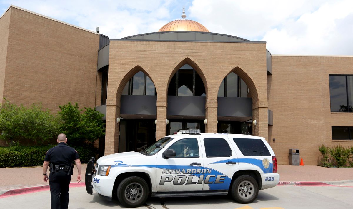 Richardson Police sit in front of the Islamic Association of North Texas mosque in the Dallas suburb of Richardson, Texas, Tuesday, May 5, 2015. Police are investigating after a worshipper leaving a prayer service at the mosque was slightly hurt after being attacked in the parking lot by two men who fled. The attack came a day after two men were shot to death in neighboring Garland after opening fire outside a contest featuring cartoons of Islams Prophet Muhammad.  (AP Photo/LM Otero) (AP)