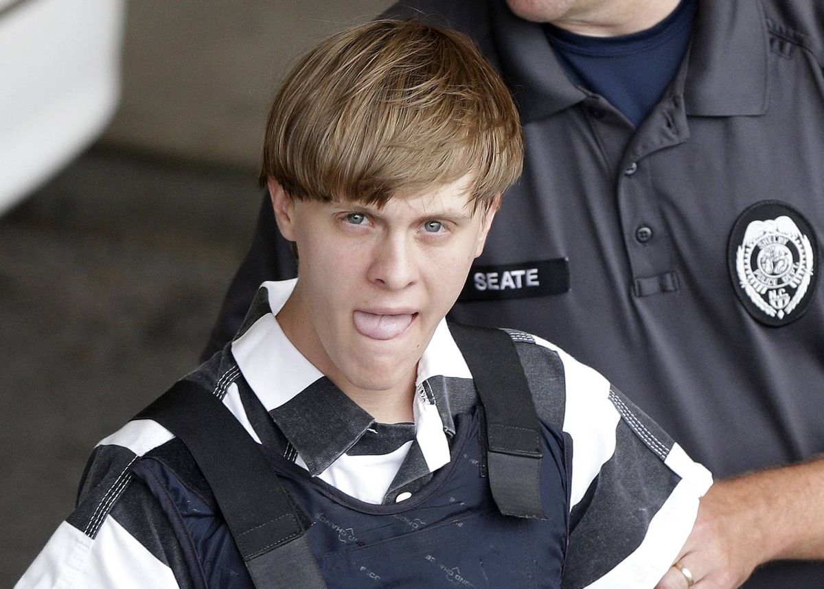 Charleston, S.C., shooting suspect Dylann Storm Roof is escorted from the Cleveland County Courthouse in Shelby, N.C., Thursday, June 18, 2015.    (AP/Chuck Burton)